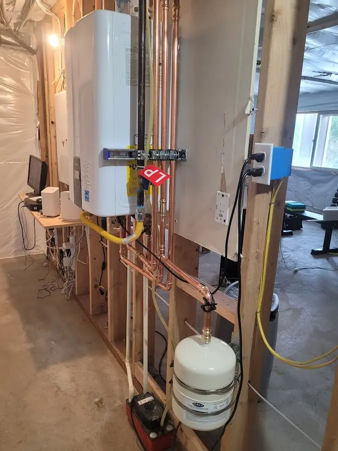 Licensed plumber repairing a kitchen sink in Kewaskum